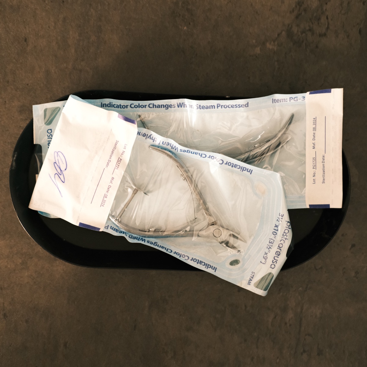Disinfected manicure tools sealed in sterilization pouches at Darlings Beauty Lab