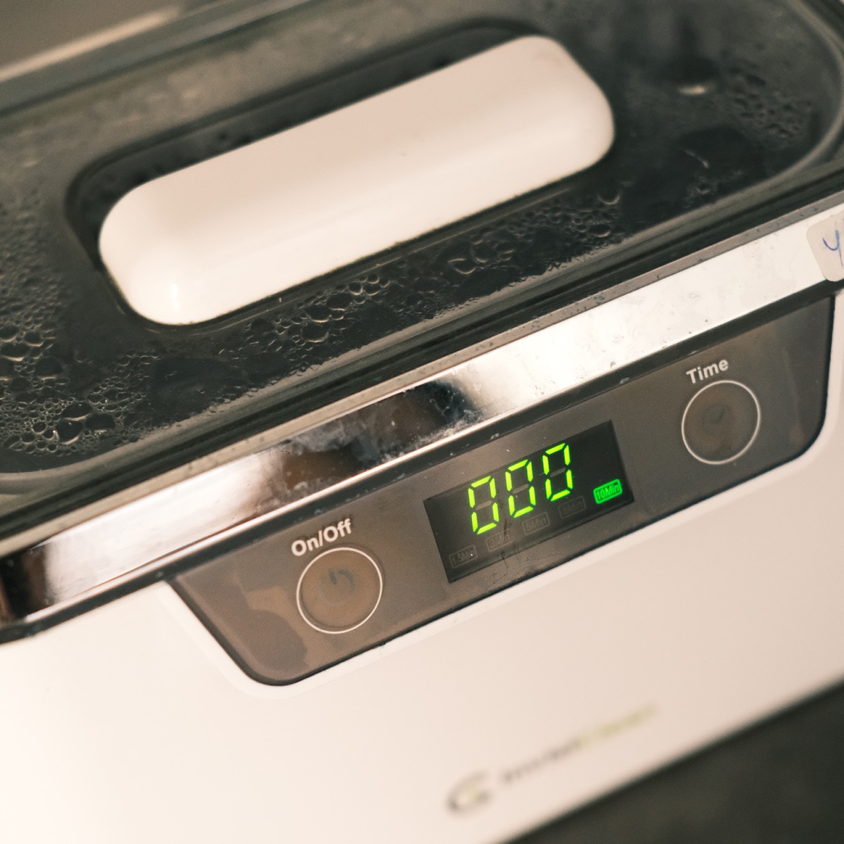 Ultrasonic cleaner used for manicure tool sanitation at Darlings Beauty Lab